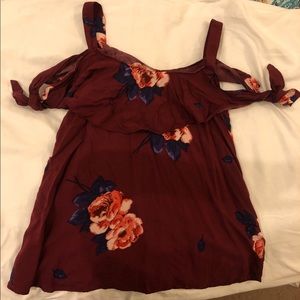 Peek-a-boo shoulder floral top.